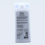 Body lotion bottle with label on a light gray background