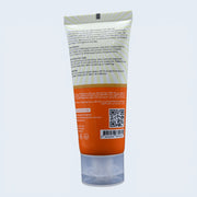 Sunblock  cream tube with label and QR code on a light gray background