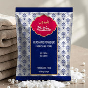 Bluwon washing powder package with folded towels and pearls in the background