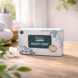 Box of Beauty Soap on a wooden surface with a blurred bathroom background